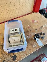 Tub containing assorted switch and outlet plates