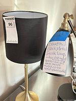 Table lamp and desk lamp side by side showing overall form, shades, and brass accents
