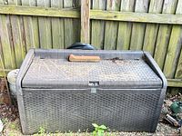 Front view of Keter resin deck box showing wicker pattern and overall size