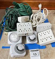 All items grouped: timers, adapters, cords, strip