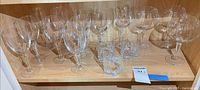 Group view of all stemware and tumblers on shelf