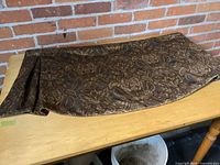 Full view of valance laid flat showing overall size, pleated end and fabric