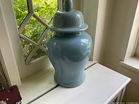 Full jar with lid on, showing overall shape and color