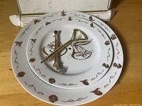 Two plates, stand hardware, and box front