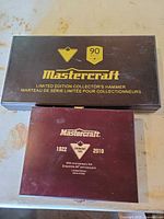 two brown Mastercraft presentation boxes, larger marked Limited Edition Collector's Hammer, smaller marked 1922-2010 88th Anniversary Set