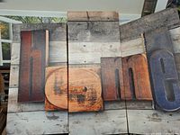 Front view of all three canvases side-by-side showing complete design