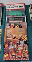 Stack showing all four catalog covers