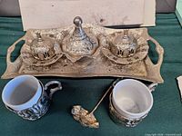 full view of set showing tray, lidded pieces, porcelain cups, spoon