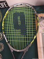 Full racket front view showing frame and strings