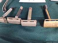 Four razors in a row showing heads and handles