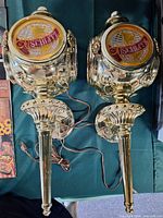Front view of both Schlitz electric wall lights