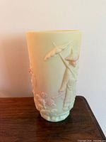 Full view of satin glass vase front showing relief figure with parasol