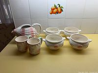 Full lot showing pitcher, two mugs and four soup bowls