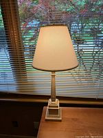 Full view of lamp lit with shade