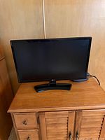 Front view of LG 22-inch LED TV on stand