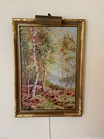 Full view of framed painting with picture light
