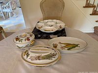 All four Royal Worcester Evesham porcelain pieces displayed together