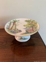 Top view of Shelley pedestal plate showing landscape and floral scene