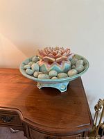 Full view of ceramic lotus fountain on furniture