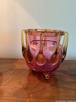 Full view of cranberry glass footed bowl with amber prunts