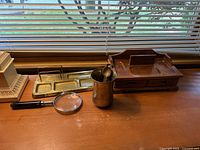All items together on desktop showing relative sizes and finishes