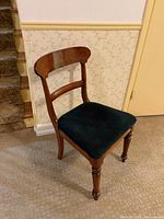Front three-quarter view of mahogany side chair showing crest rail, seat, and legs