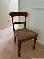 Full view of vintage wooden side chair facing front left