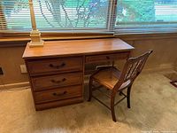 Front view of desk and chair showing overall design and condition