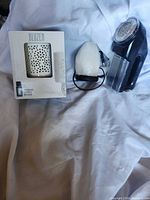Three items: boxed Bluzen diffuser, salt lamp, fabric shaver