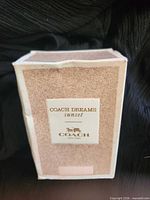 Front view of Coach Dreams Sunset retail box
