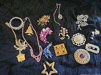 Entire spread of 15 costume jewelry pieces