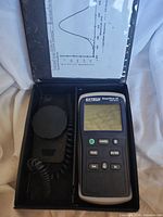 Light meter and sensor inside carrying case