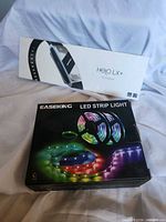 Both retail boxes of Helo LX+ tracker and Easeking LED strip light