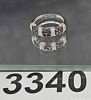 Full view of the ring showing cluster pattern and overall condition