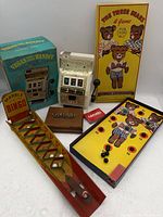 Group shot of all games, slot bank with box, card case, loose marbles
