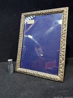 Front view showing sterling floral trim and glass insert