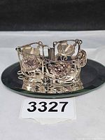 Bracelet standing circular arrangement showing floral panels and clasp