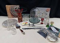 Entire lot overview showing all silver-plated, glass and ceramic items