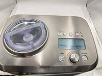 Top view showing control panel, clear lid and stainless finish