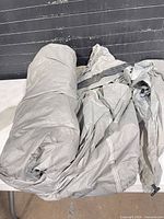 Gray folded tent fabric on table