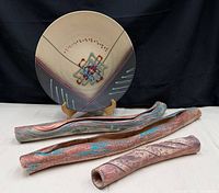 Overview of plate on stand with three wall pocket vases