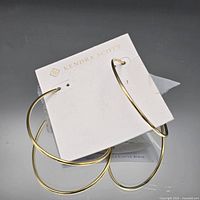 Both hoop earrings on Kendra Scott branded card