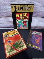 Front view of all three items: Whiz Comics reprint, Flash Gordon comic, Wonder Woman Colorforms box