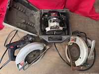 Overview of Craftsman router in case, Skilsaw circular saw, second circular saw