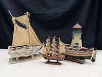 Overall view of four nautical décor pieces