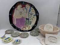 Overview of all ceramic items including large wall plate, small plates, trinket dishes, tiles and bowl
