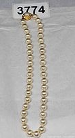 Full view of pearl necklace with clasp