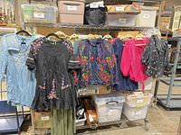 Rack showing all six garments on hangers