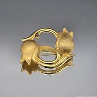 Front view showing gold-tone double tulip floral design