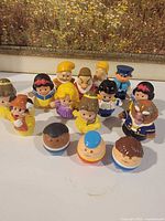 Group shot of 17 Little People figures